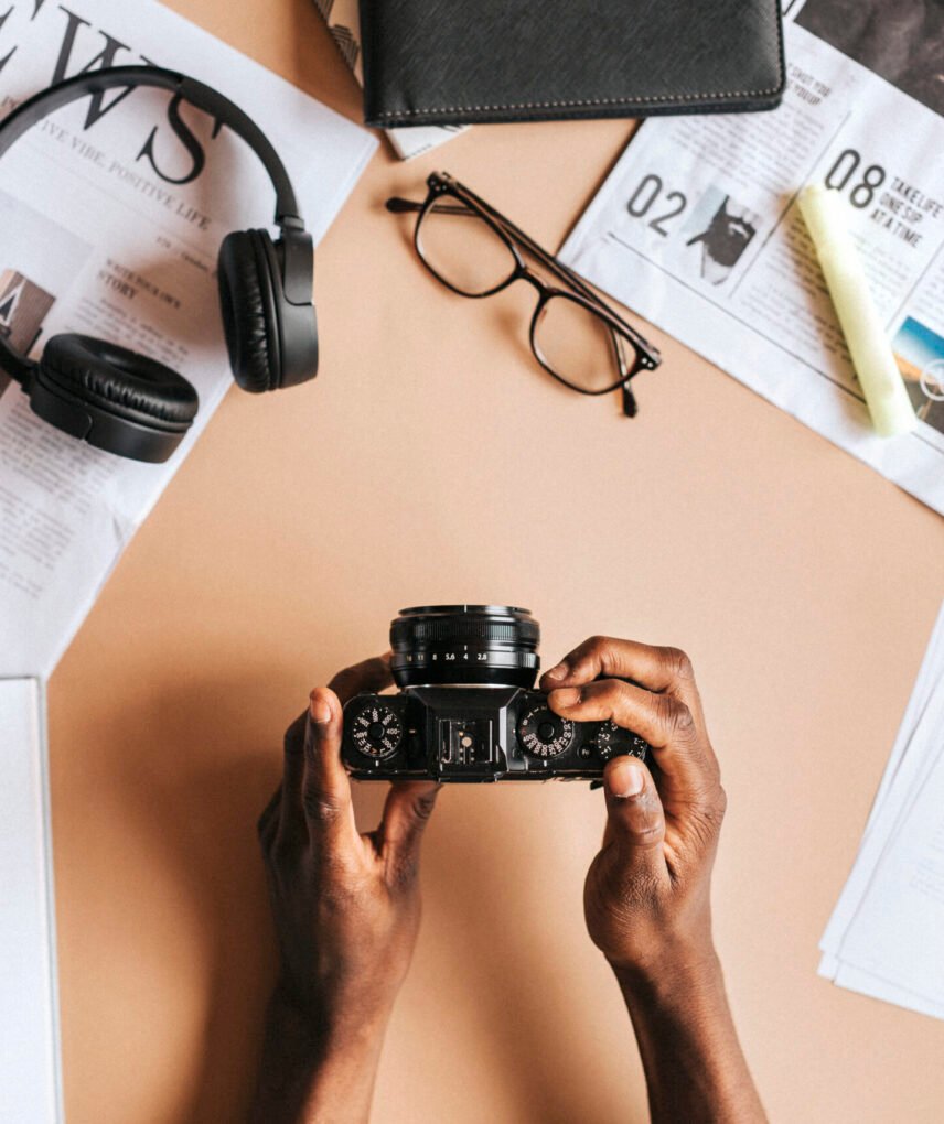 Black man using an analog camera